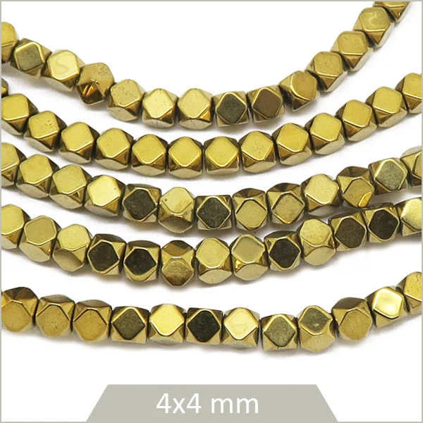Env. 100 perles polygones 4 mm en hématite doré métallisé