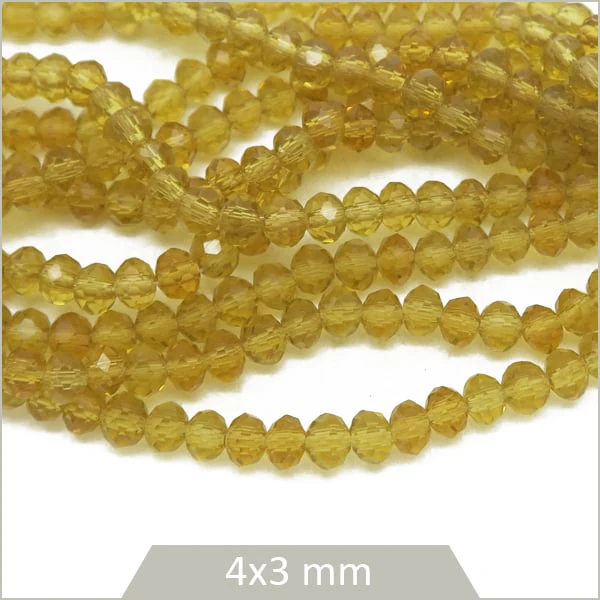 Env. 120 perles de verre à facettes donut transparentes couleur miel