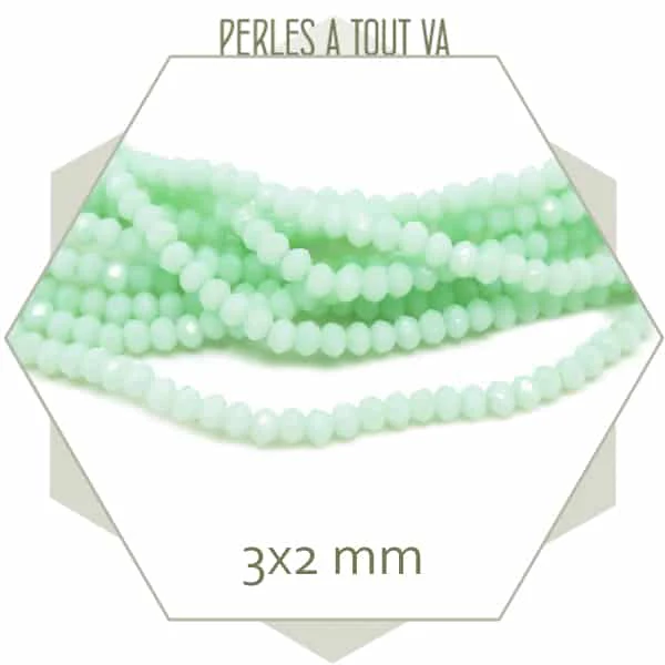 Env. 155 perles de verre donut vert d'eau 3x2 mm
