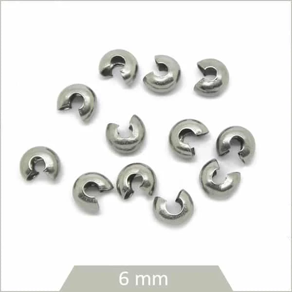 Env. 30 perles cache nœud en acier 6 mm