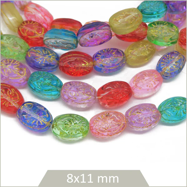 Env. 30 perles ovales gravées et colorées en verre