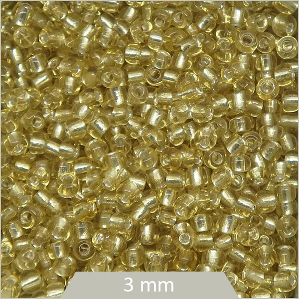 40 g de perles rocailles 3 mm miel transparent et centre argenté
