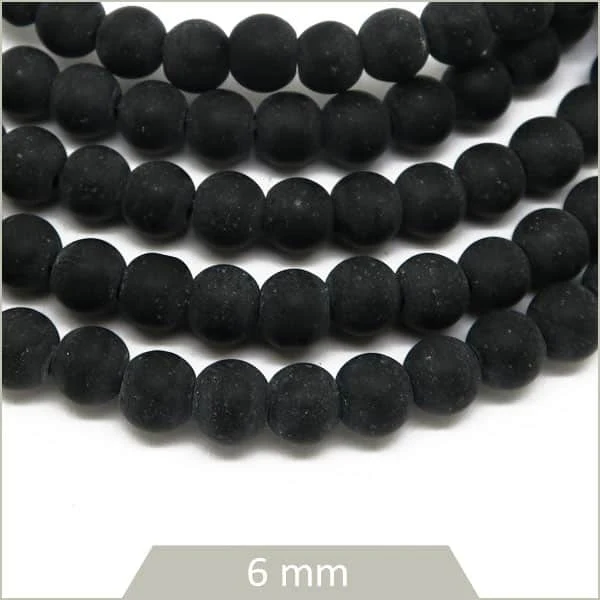 Env. 70 perles rondes en pierre noir reconstituée, 6 mm