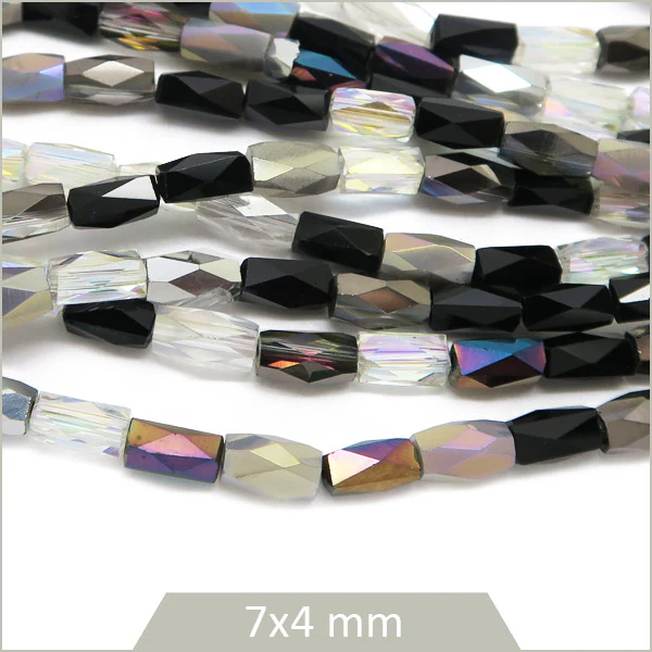 Env. 70 perles colonnes à facettes 7x4 mm, noir et blanc