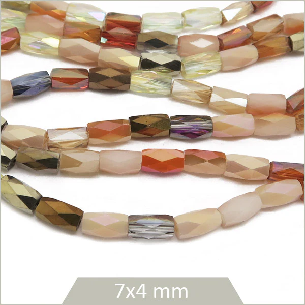 Env. 70 perles colonnes à facettes 7x4 mm, nude et or