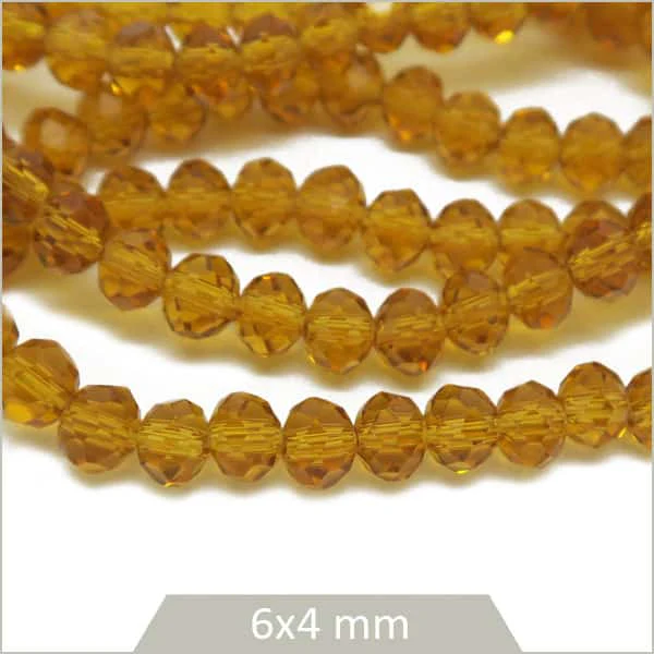 Env. 85 perles de verre à facettes donut miel transparent 6x4 mm